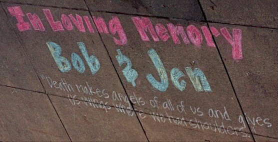 A picture of the sidewalk memorial which was written in chalk at NHS on November 21, 1997 in honor of Bob and Jen
